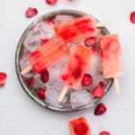 strawberry lemonade popsicles on top of ice