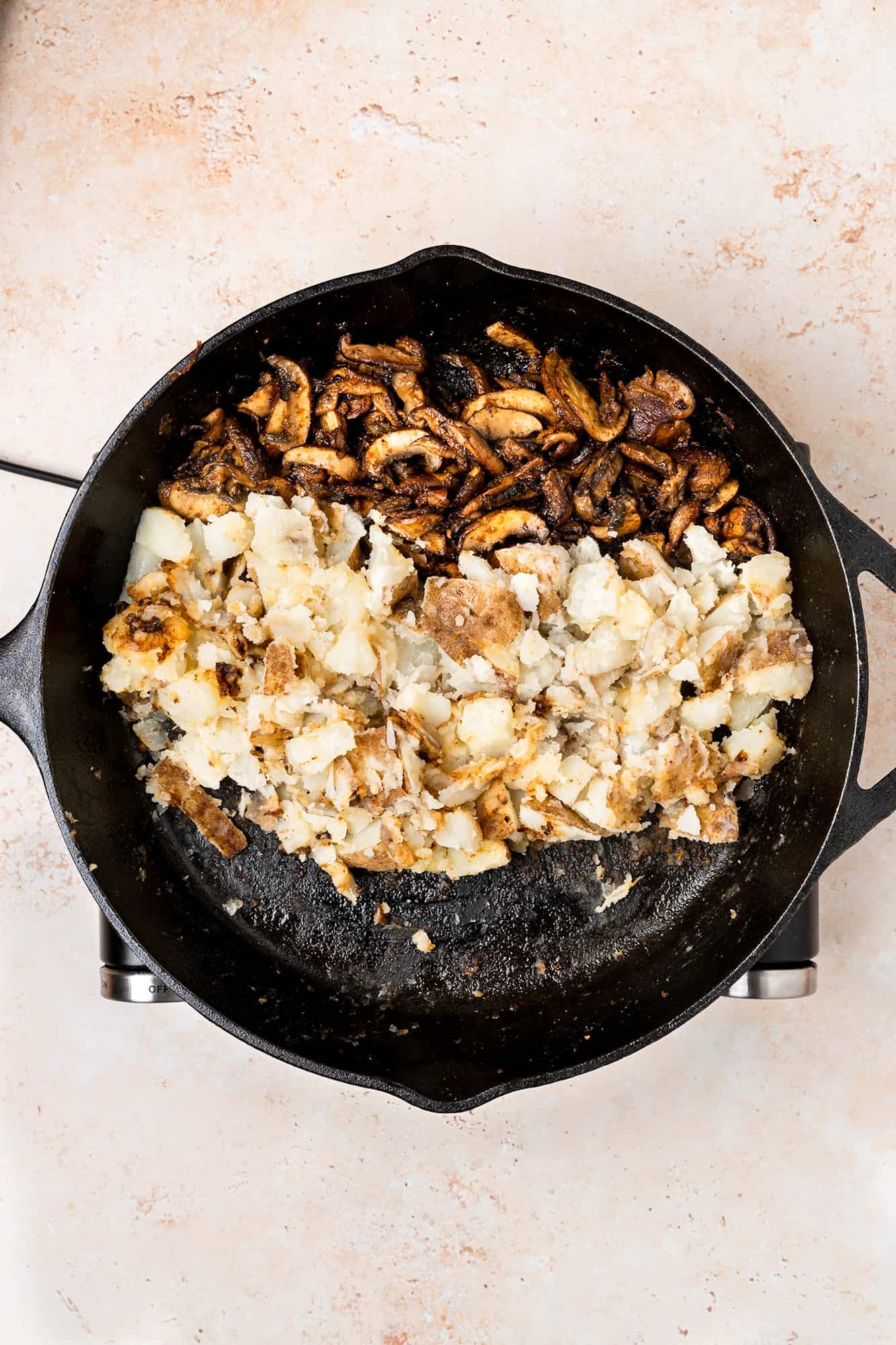 mushrooms and potatoes in a skillet