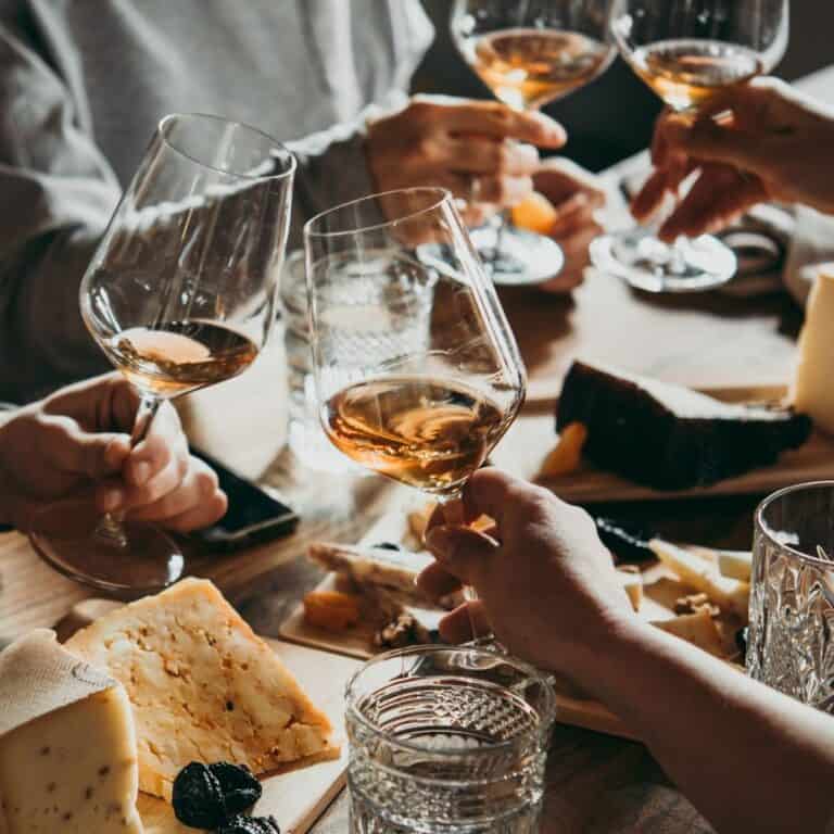 Cheers-ing with wine glasses at an italian restaurant