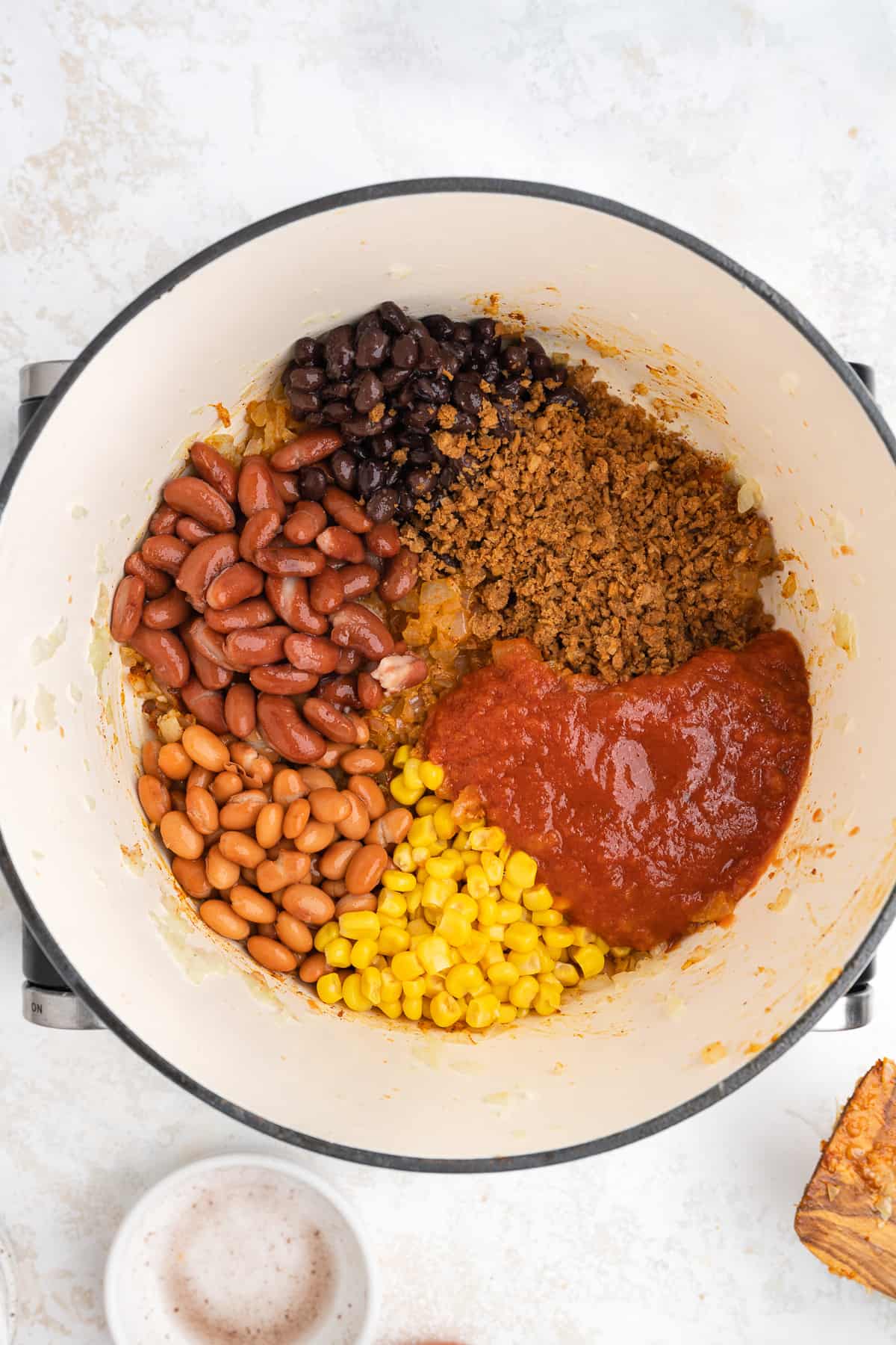 all vegan chili ingredients in a pot, unmixed