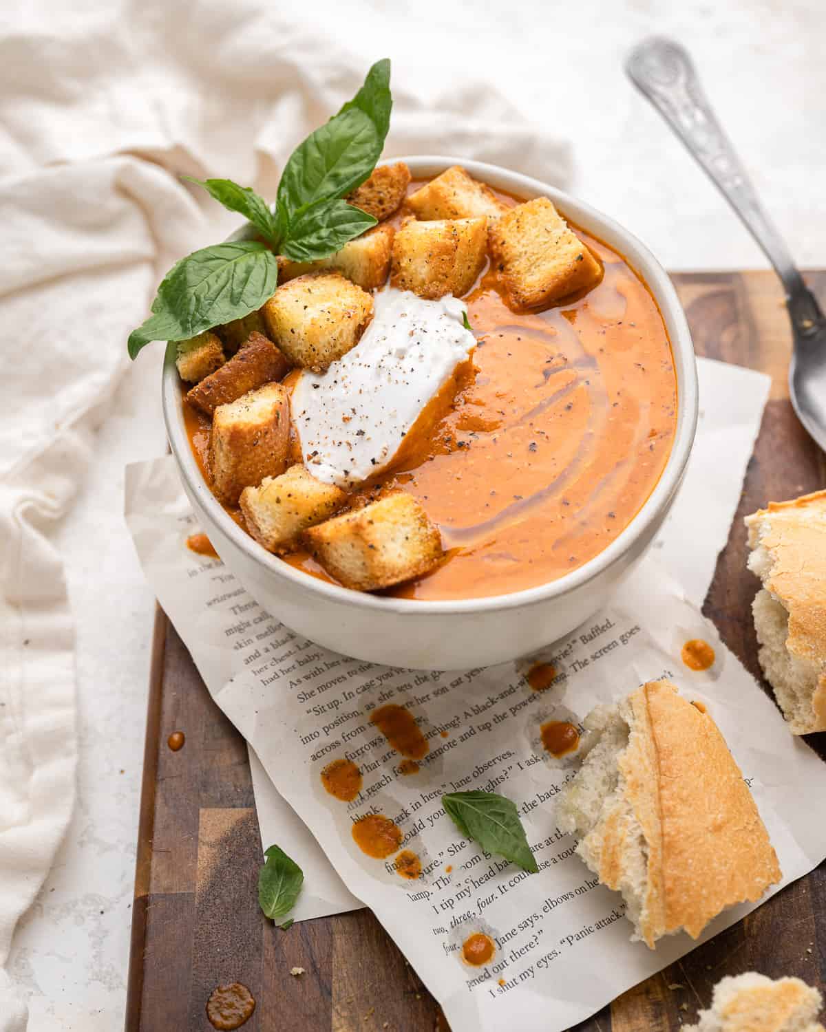 close up of creamy tomato soup in a bowl