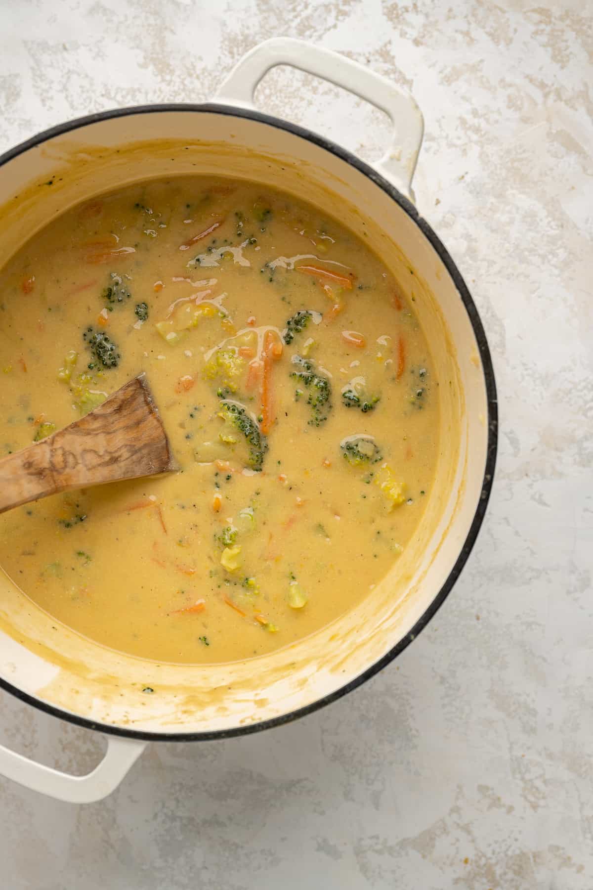 fully cooked broccoli cheddar soup in a pot.