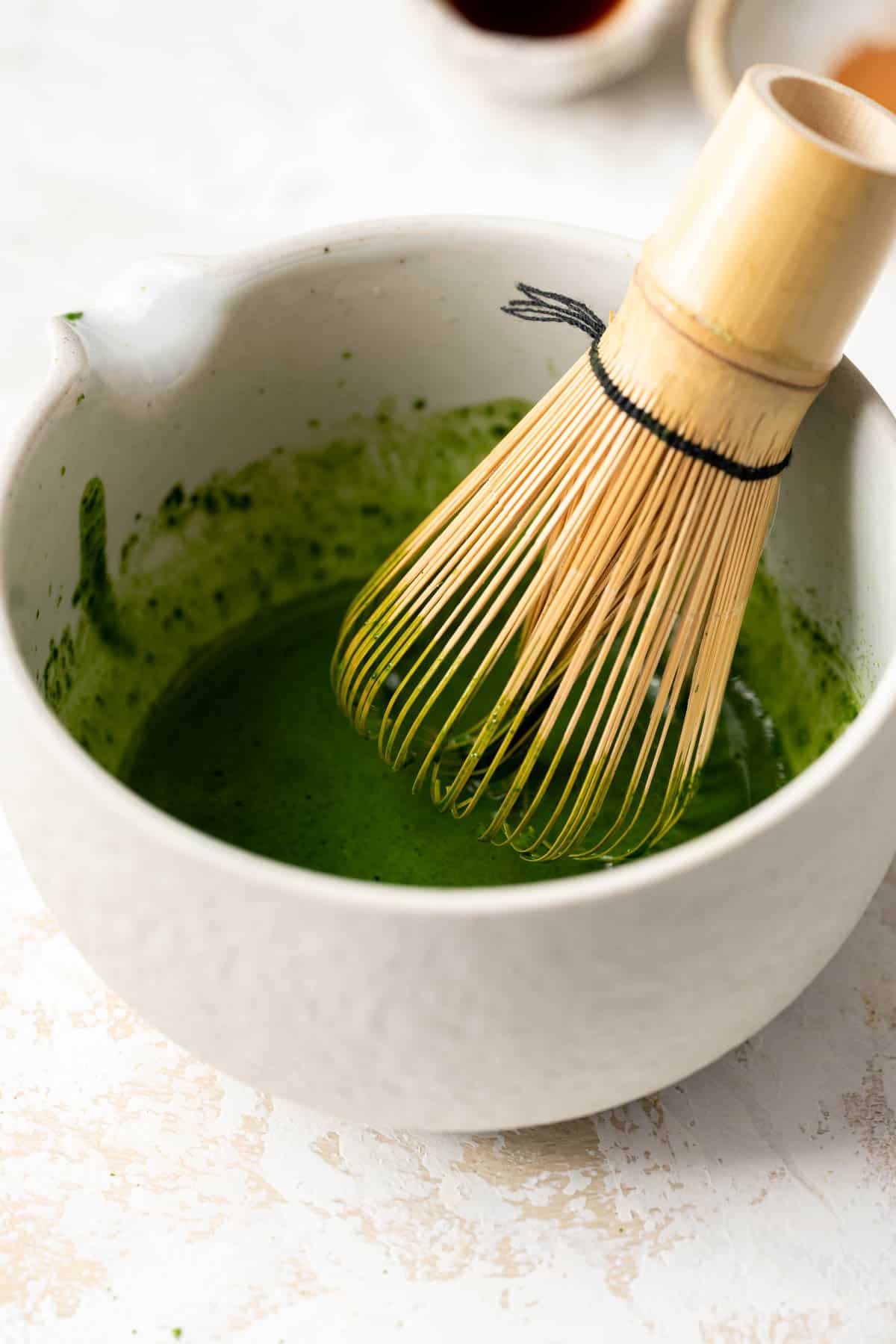 matcha powder being whisked.