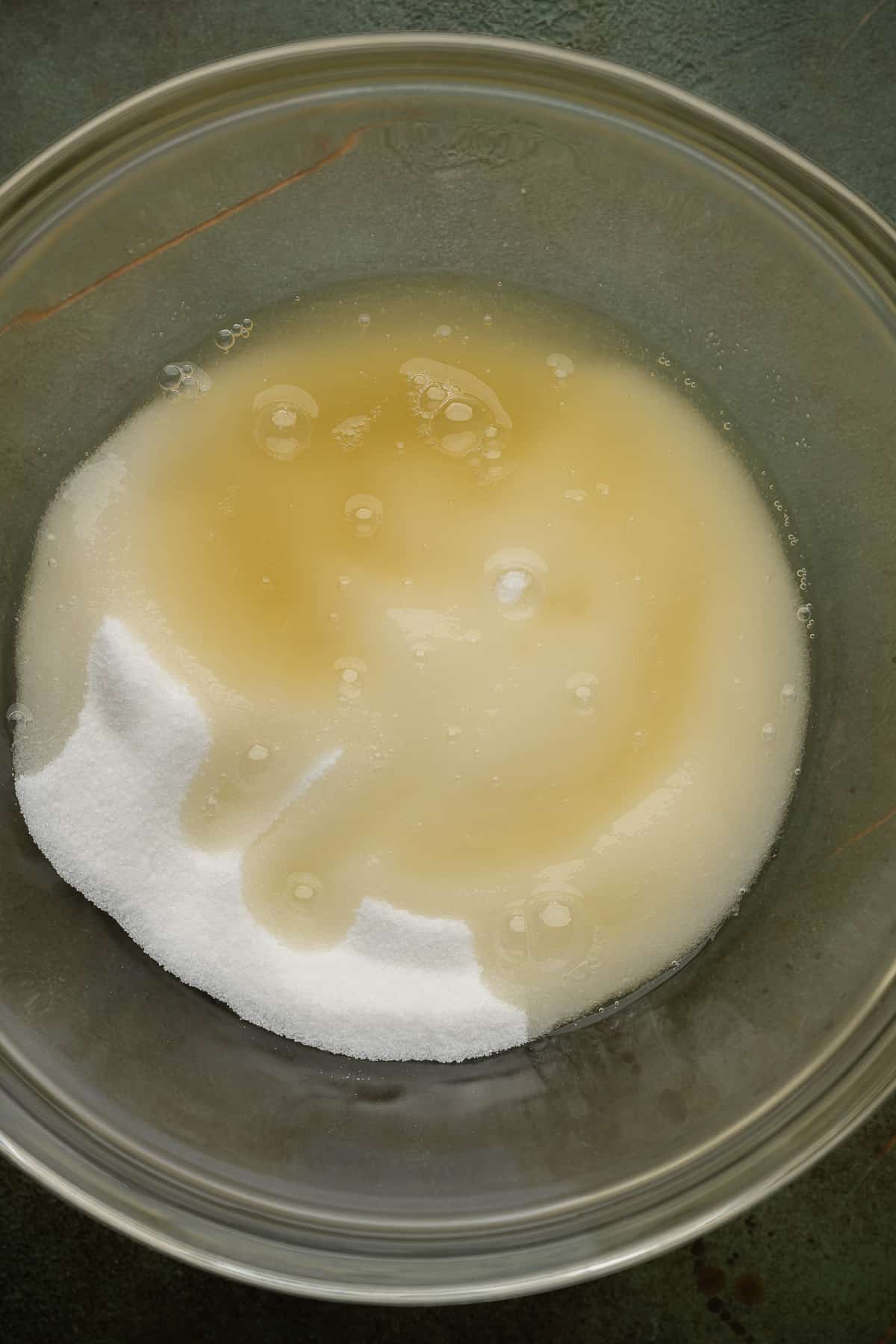 aquafaba and sugar in a bowl.
