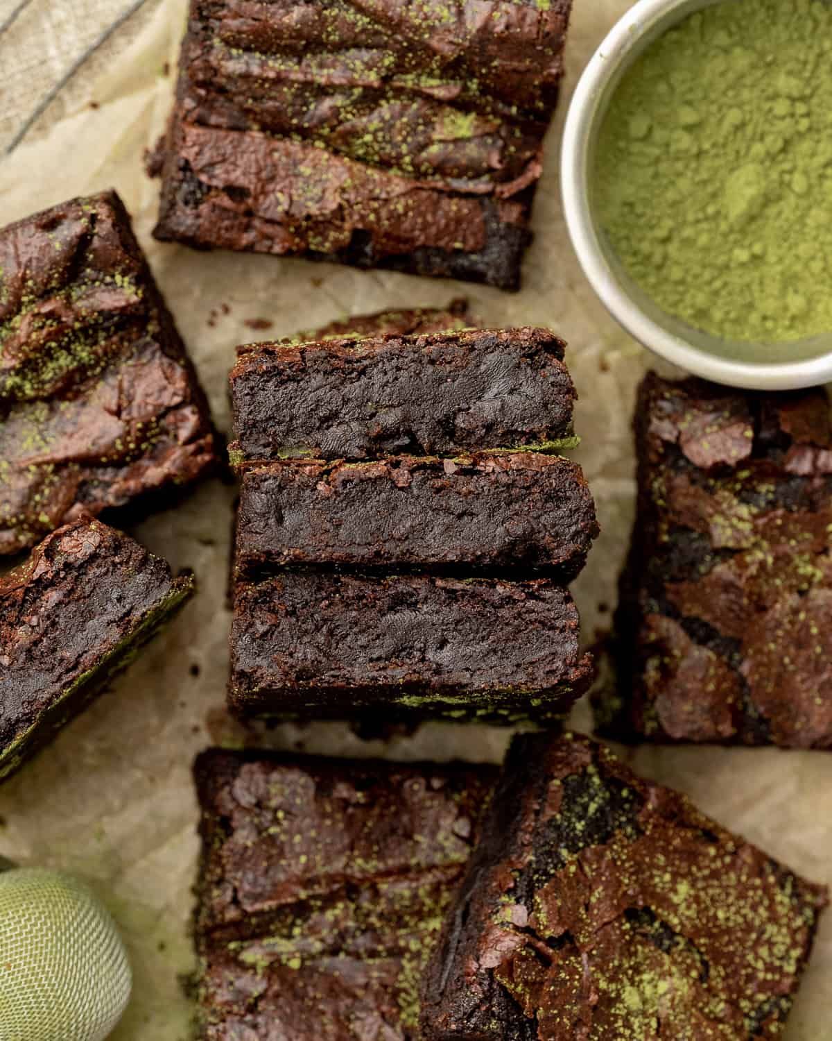 matcha brownies stacked with the insides showing.