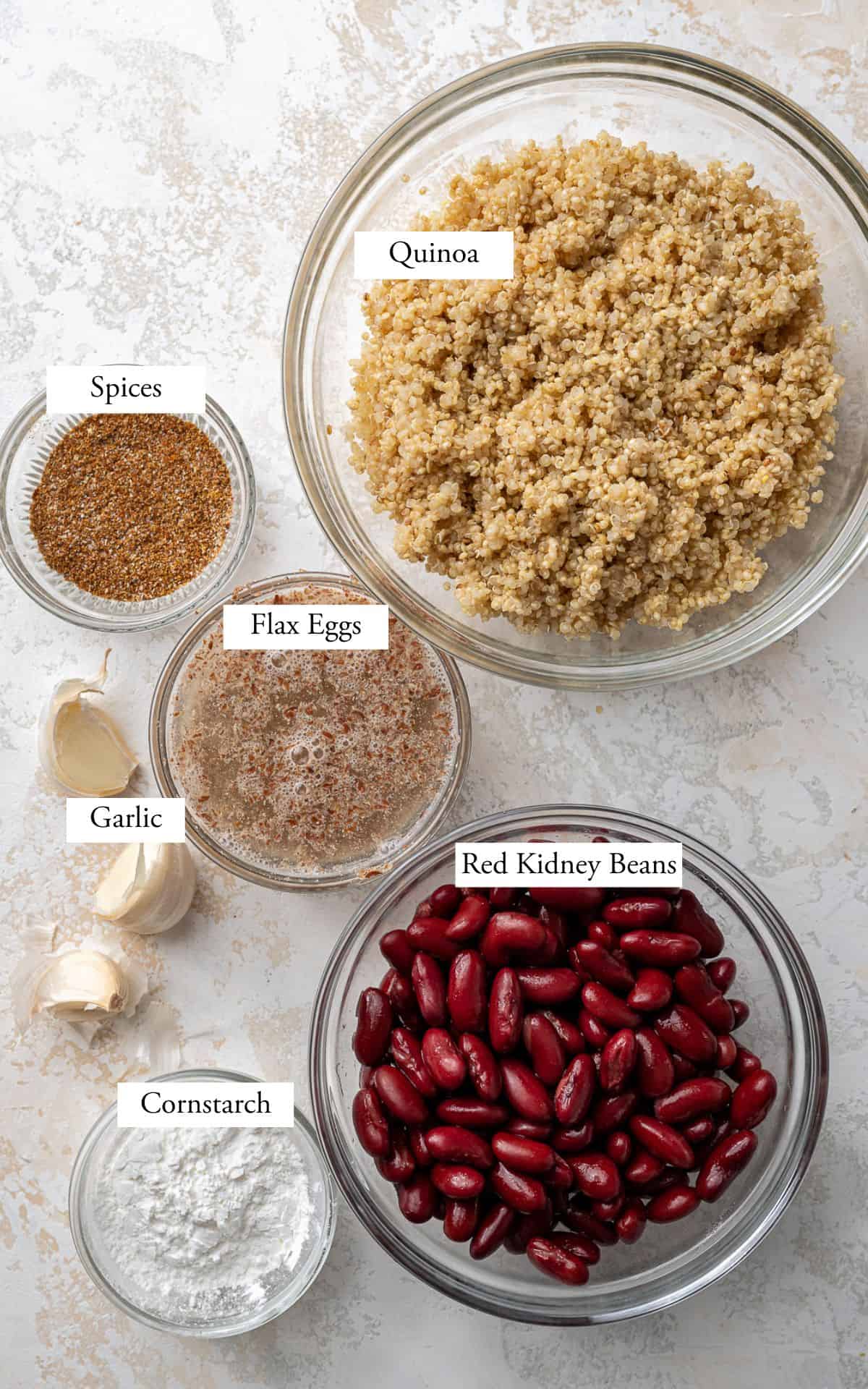 quinoa burger ingredients in bowls.