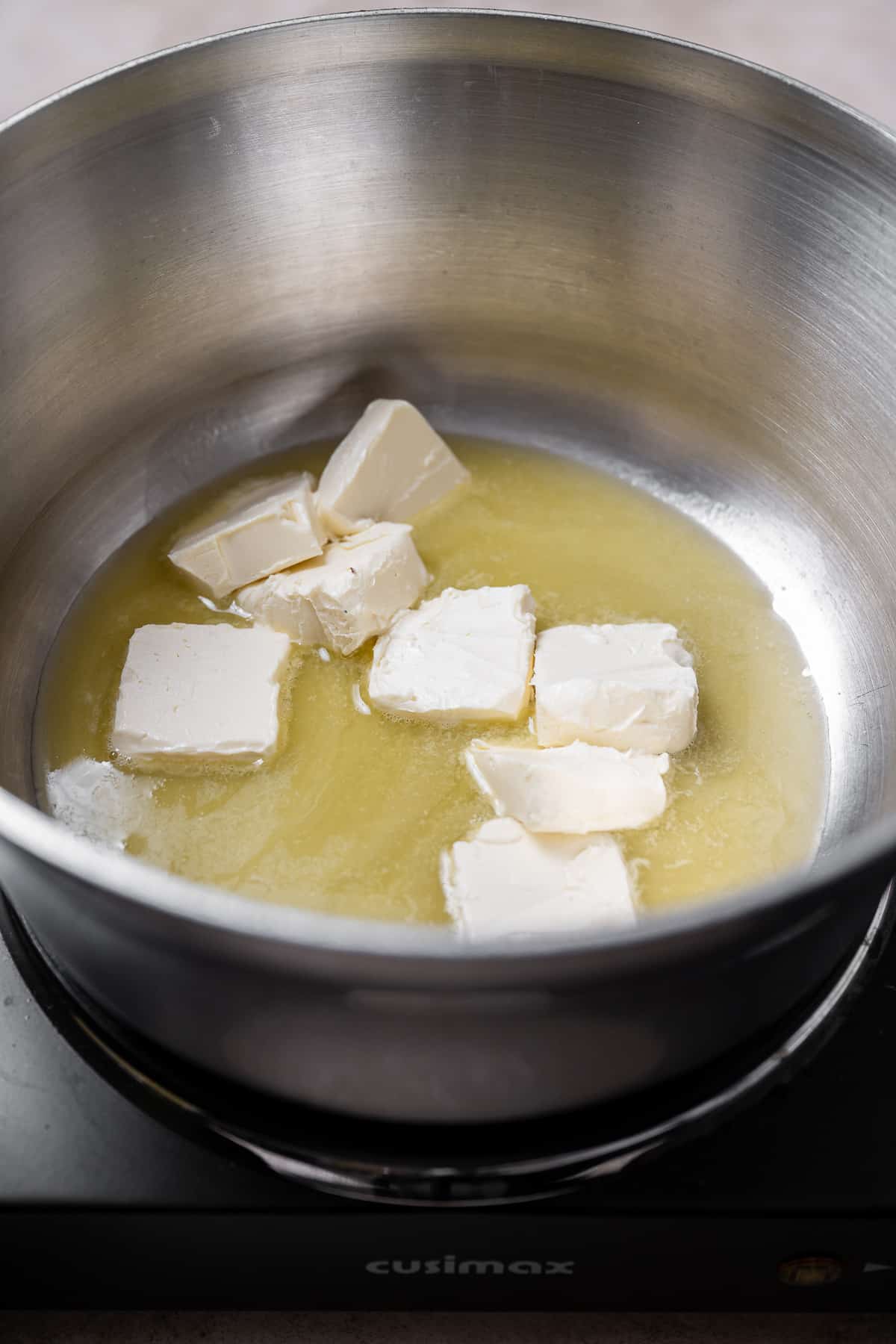 butter being melted in a saucepan.