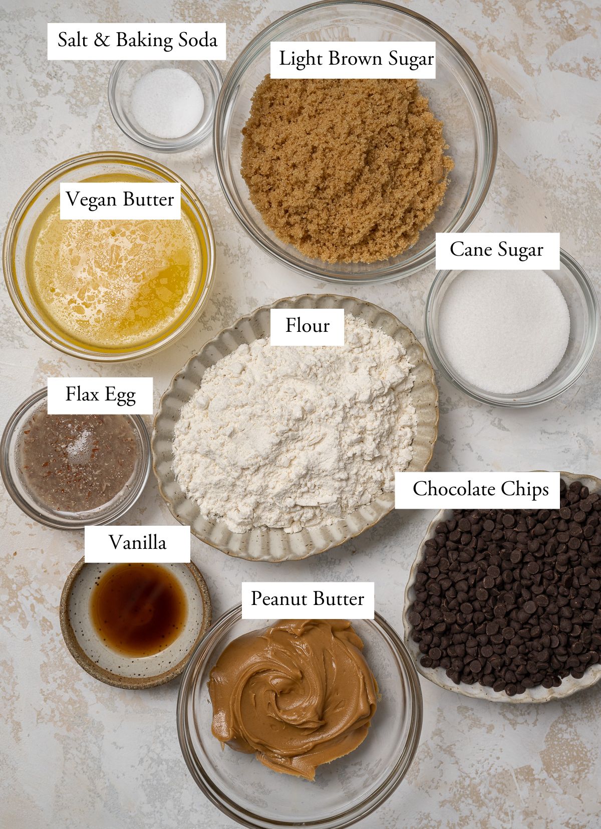 vegan peanut butter chocolate chip ingredients in individual bowls.