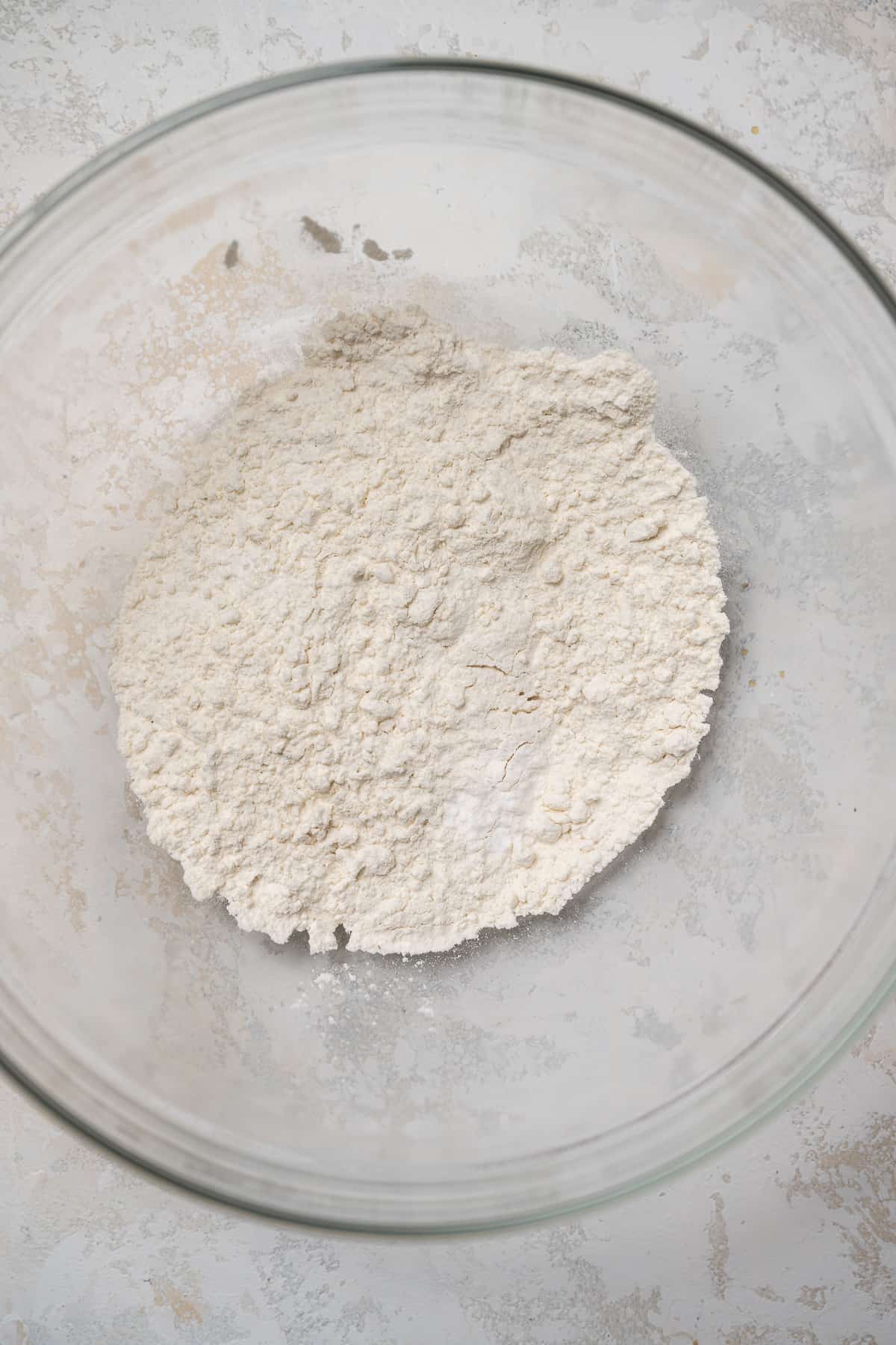 flour, baking soda, and salt in a glass mixing bowl.