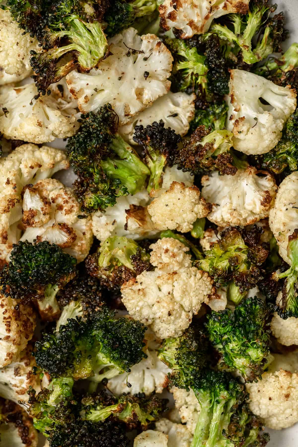 close up of air fryer broccoli and cauliflower.