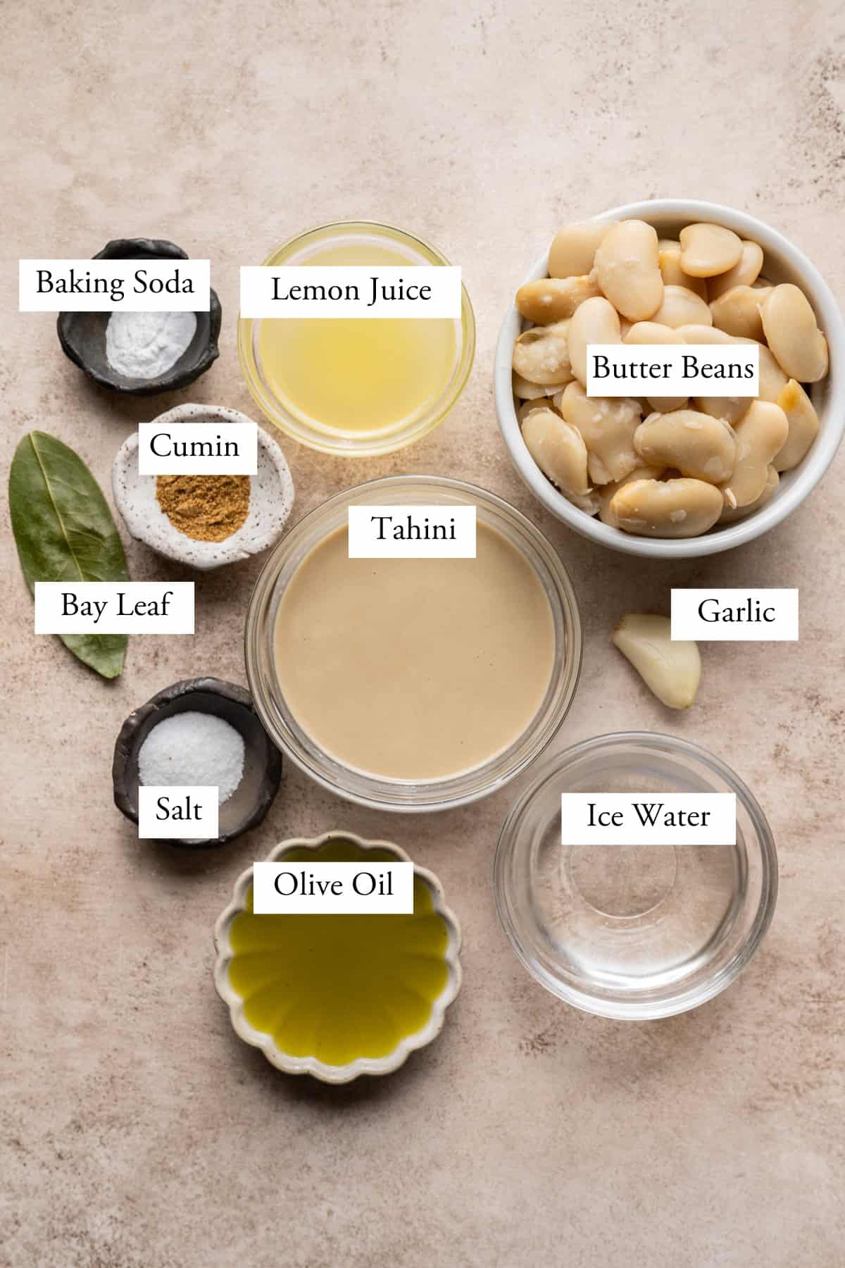 Ingredients for butter bean hummus in bowls.