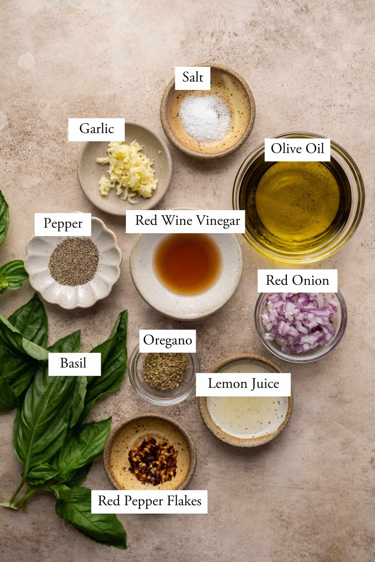 ingredients for basil chimichurri in individual bowls.