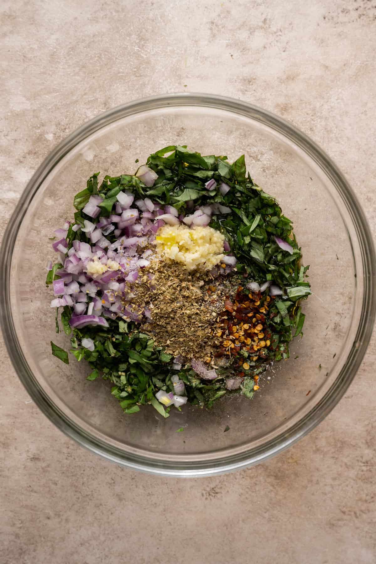 ingredients for basil chimichurri in a mixing bowl.